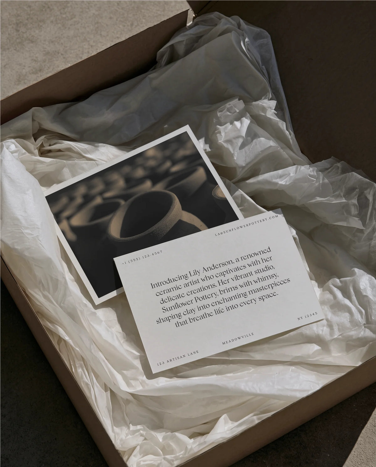 Pottery studio printed cards using Chiffon typography, arranged inside a tissue-lined packaging box.