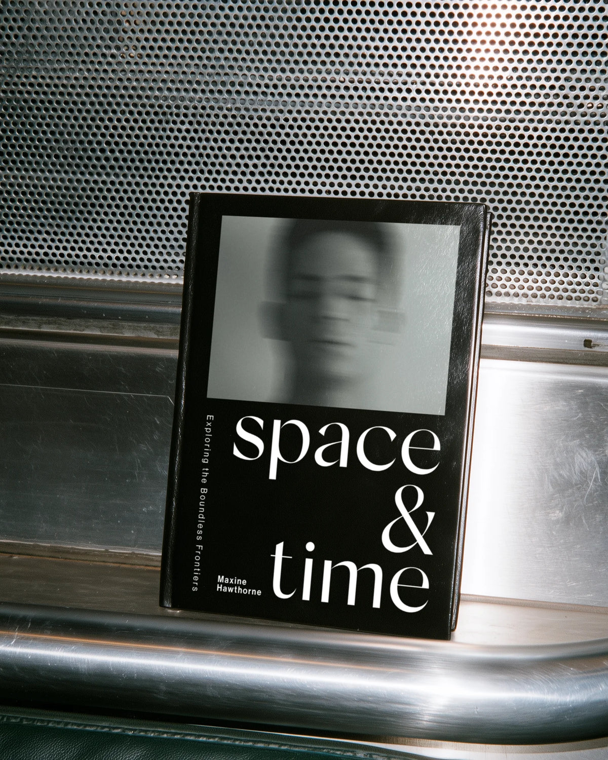 Black editorial book cover titled “Space & Time” using Silk Sans typography in a high-contrast graphic layout.