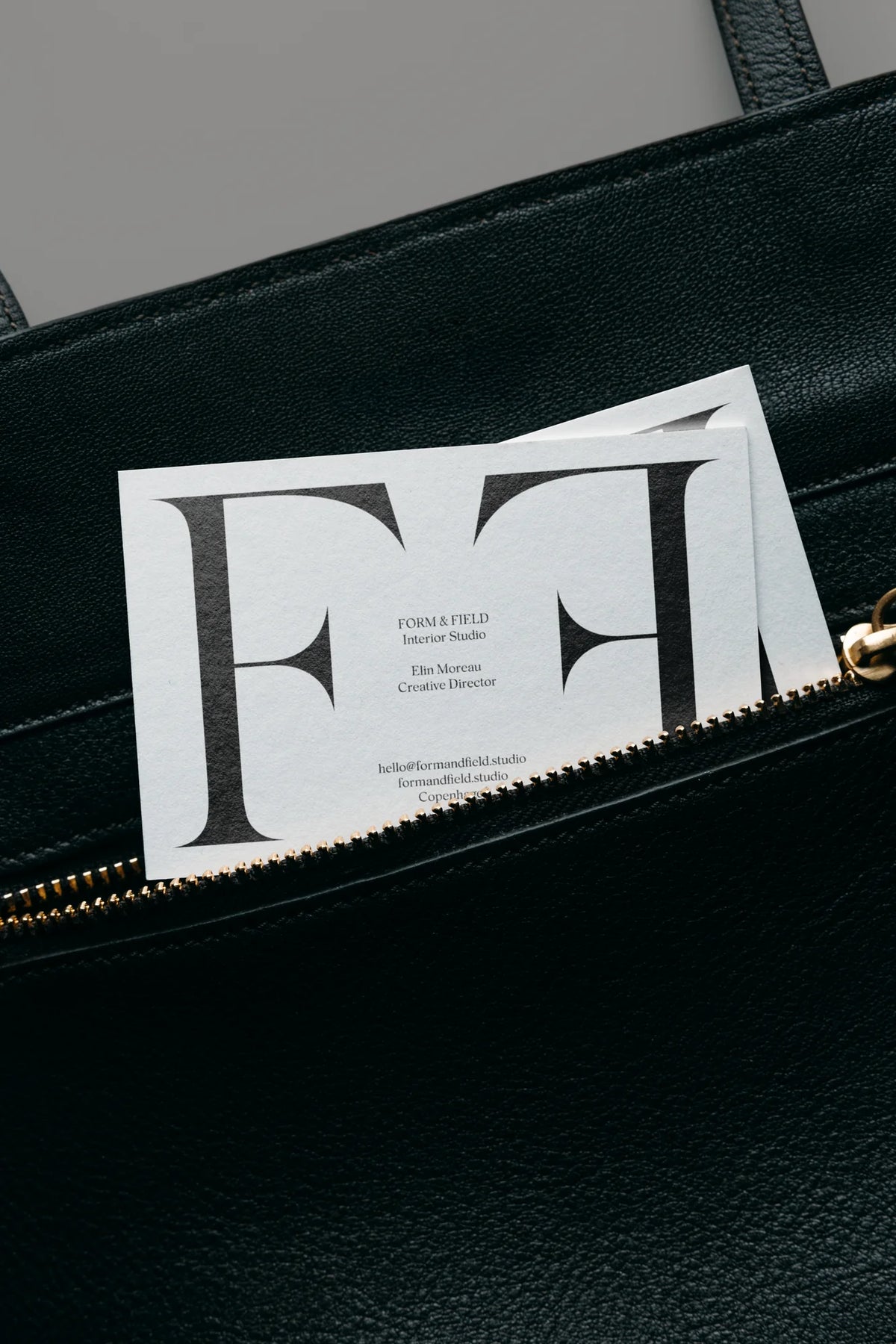 Silk Serif font used on a minimalist interior studio business card with oversized serif typography.