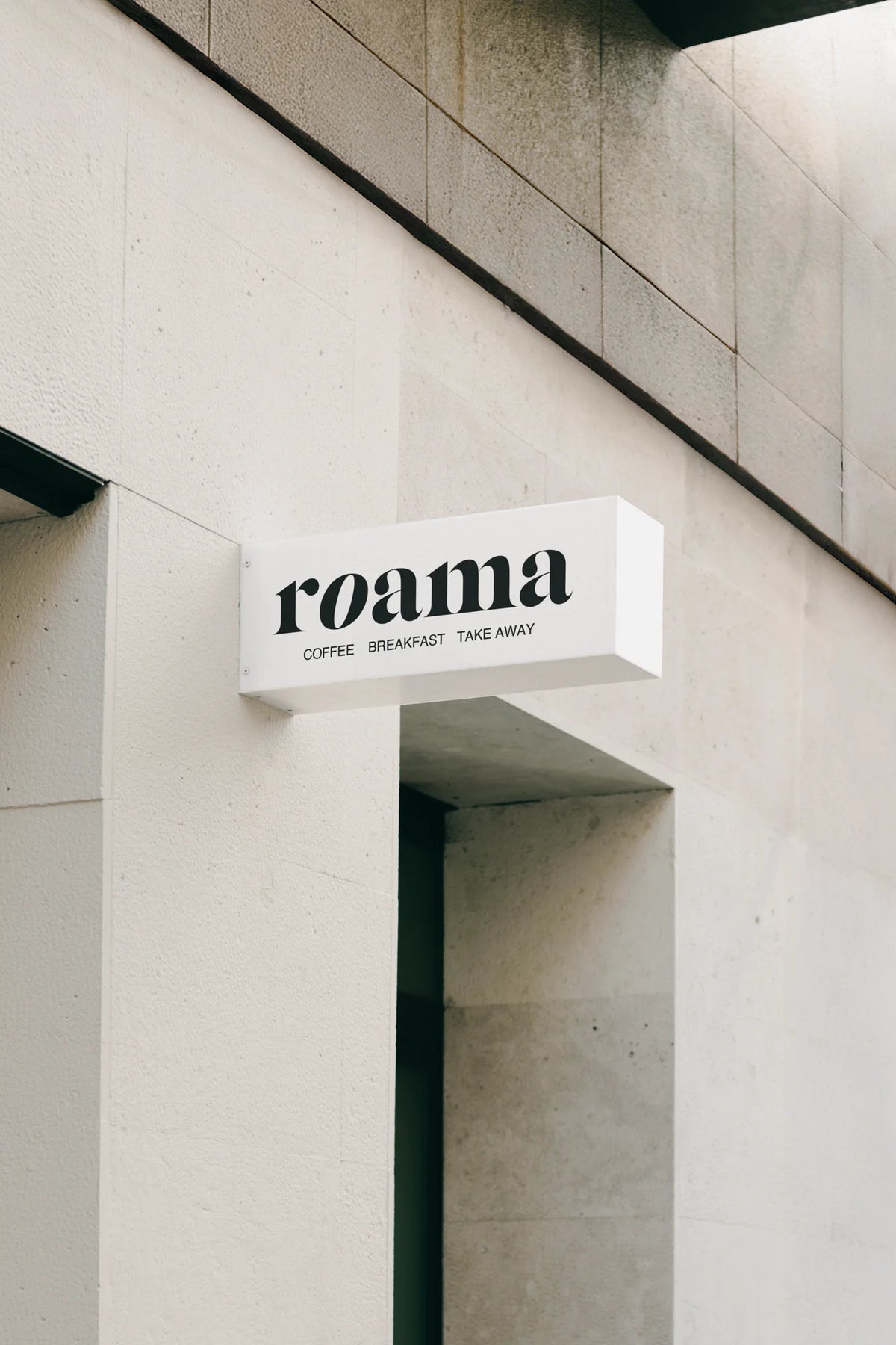 Silk Serif font used on exterior café signage with bold italic serif branding.